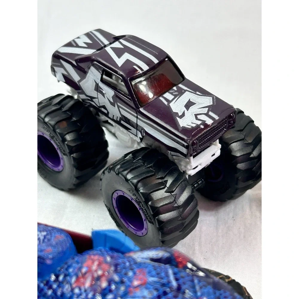 Lot Of 4 Diecast Monster Trucks 3 Hot wheels El Toro Grave Digger Rattlesnake